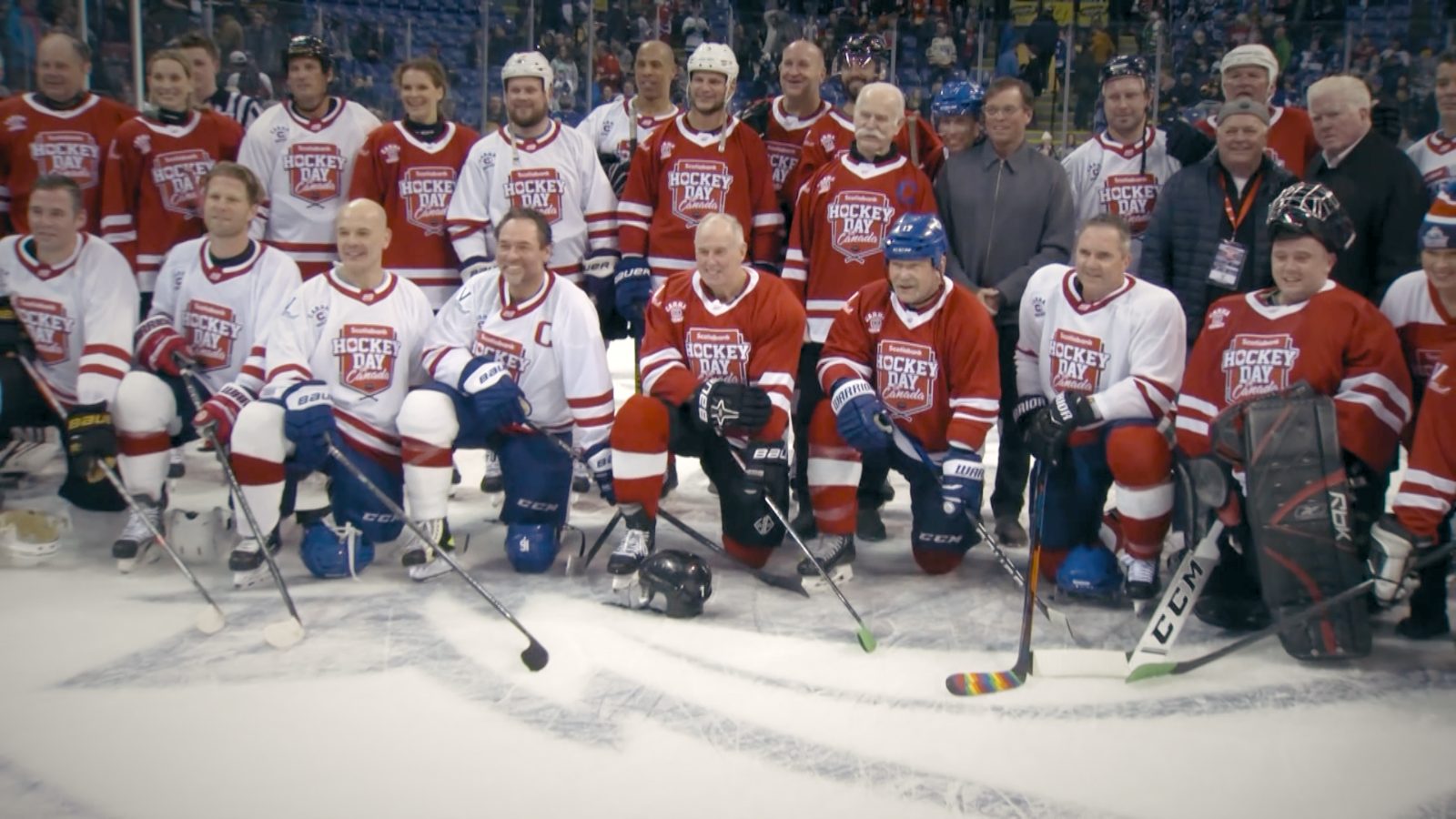 Hockey Day in Canada team photo on the ice